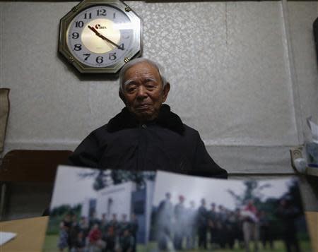 Kim Chang-sun, who is a former Kuwol Guerrilla Unit member, poses for photographs during an interview with Reuters at Kuwolsan Guerrilla Unit Comrade Association's office in Seoul November 29, 2013. REUTERS/Kim Hong-Ji