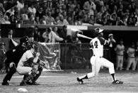 Atlanta Braves' Hank Aaron (44) breaks Babe Ruth's record for career home runs as he hits his 715th off Los Angeles Dodgers pitcher Al Downing in the fourth inning of the game opener at Atlanta-Fulton County Stadium, Ga., April 8, 1974. (AP Photo)