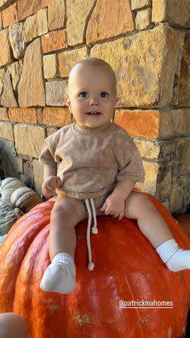 <p>Brittany Mahomes/Instagram</p> Bronze Mahomes sits on a giant pumpkin