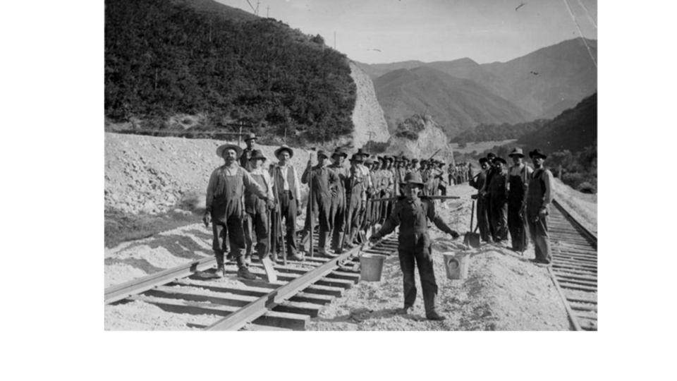 Railroad workers standing near the construction of a line change in Utah. (Photo: University of Utah J. Willard Library)
