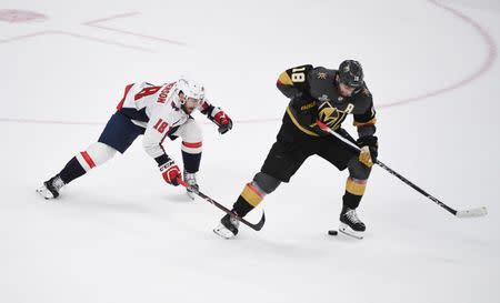 May 30, 2018; Las Vegas, NV, USA; Washington Capitals center Chandler Stephenson (18) chases Vegas Golden Knights left wing James Neal (18) in the third period in game two of the 2018 Stanley Cup Final at T-Mobile Arena. Stephen R. Sylvanie-USA TODAY Sports