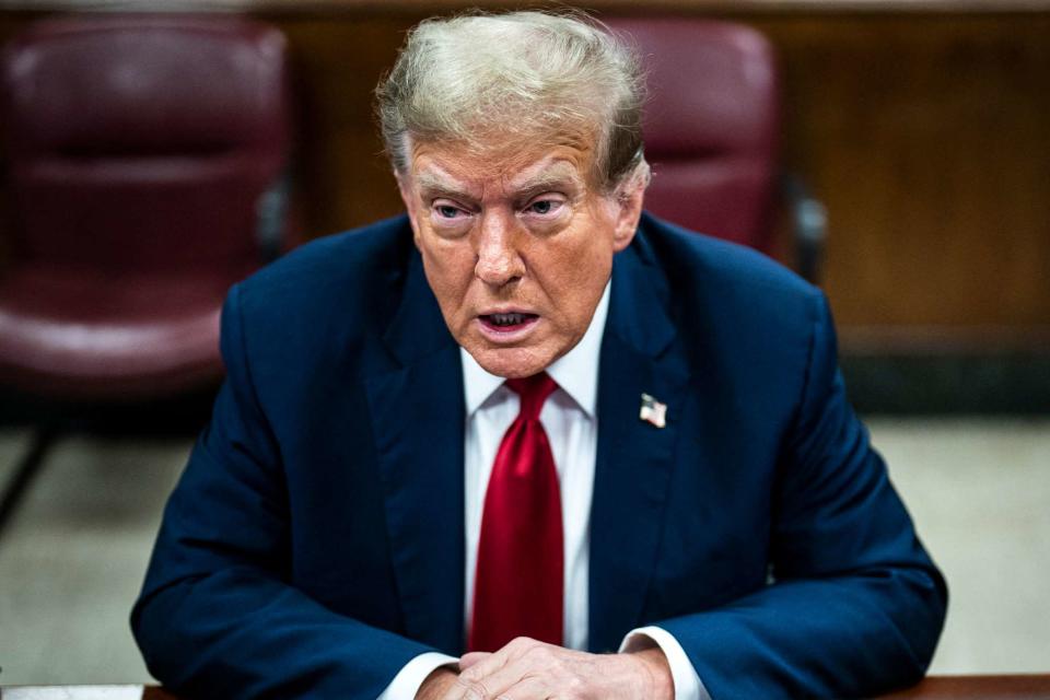 <p>JABIN BOTSFORD/POOL/AFP via Getty </p> Donald Trump sits in the courtroom for day one of his Manhattan trial on 34 felony counts of falsified business records