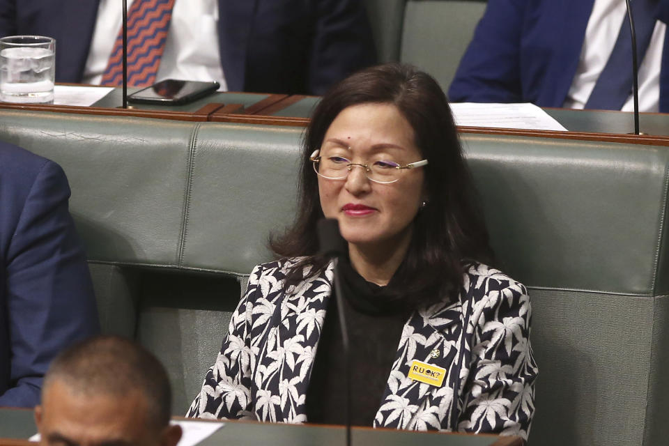 In this Sept. 12, 2019, photo, government lawmaker Gladys Liu sits in Parliament House in Canberra, Australia. Lawyers for Liu, the first Chinese-born lawmaker to be appointed to Australia's Parliament, and for a senior government minister have appeared in a court to fight challenges to their elections over misleading Chinese-language campaign signs. (AP Photo/Rod McGuirk)