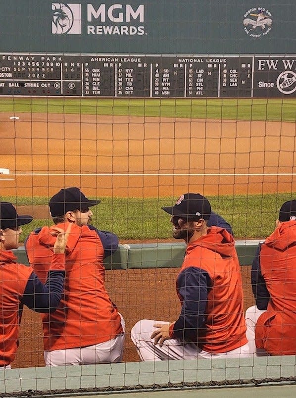 Portsmouth High School graduate Mike Montville, second from right, has a conversation in the Boston Red Sox dugout prior to a game against the Kansas City Royals in September 2022 at Fenway Park. Montville, a hitting coach with Red Sox Triple-A affiliate Worcester Red Sox, was told Monday the organization wasn't bringing him back in 2024.