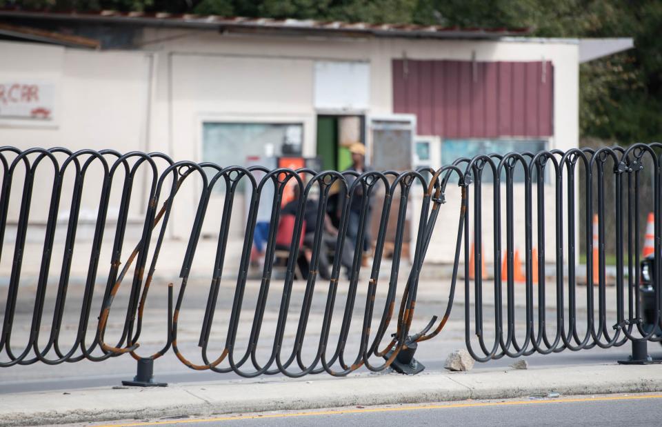Sections of the metal barrier are rusted and damaged in the median along West Cervantes Street in Brownsville on Thursday, Feb. 15, 2024.