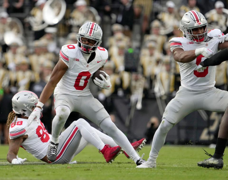 Oct. 14, 2023; Lafayette, In., USA; 
Ohio State Buckeyes wide receiver Xavier Johnson (0) runs the football during the first half of Saturday's NCAA Division I football game against the Purdue Boilermakers at Ross-Ade Stadium in Lafayette.