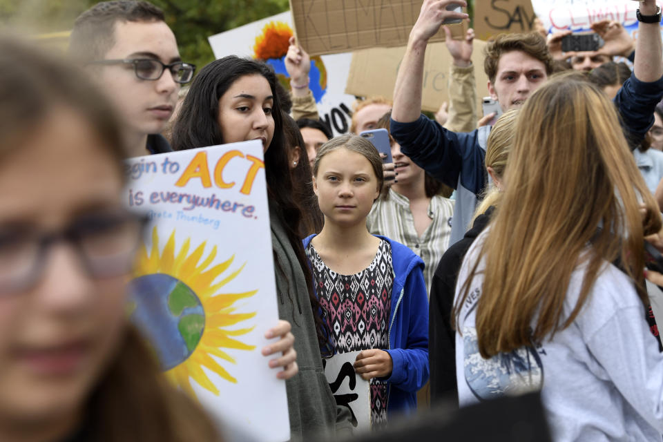 Swedish youth climate activist Greta Thunberg, center, marches with other young climate activists for a climate strike outside the White House in Washington, Friday, Sept. 13, 2019. (AP Photo/Susan Walsh)