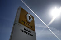 The logo of French carmaker Renault is pictured at the Flins plant of French carmaker Renault in Aubergenville, west of Paris, Monday, May 25, 2020. French President Emmanuel Macron is set to unveil sweeping new measures to rescue France's car industry, hammered by virus lockdown and the resulting recession. The issue is politically sensitive, since France is proud of its auto industry, which employs 400,000 people and is an important part of the country's remaining manufacturing sector. (AP Photo/Christophe Ena)