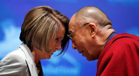 FILE PHOTO: The Dalai Lama greets U.S. Speaker of the House Nancy Pelosi during the Tom Lantos Human Rights Prize award ceremony in the Capitol in Washington October 6, 2009. REUTERS/Kevin Lamarque/File Photo