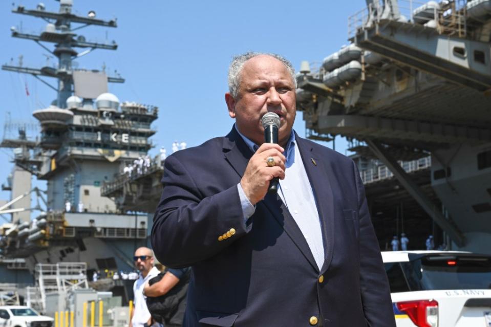 Secretary of the Navy Carlos Del Toro speaks at a ceremony marking the return of USS <em>Dwight D. Eisenhower</em> to its home port in Norfolk, Virginia on July 14, 2024. <em>USN</em>
