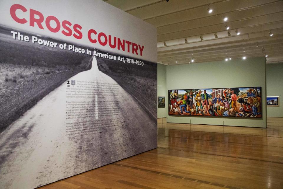In this Monday, Feb. 6, 2017 photo, the entrance to the exhibit "Cross Country: The Power of Place in American Art, 1915-1950," is seen at the High Museum of Art in Atlanta. The new exhibition at takes a look at how American artists during the modernist period traveled outside cities to find inspiration in the rural landscape. (AP Photo/David Goldman)