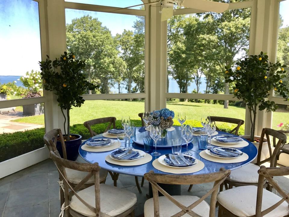 6) A screened dining porch has views of the Atlantic Ocean.