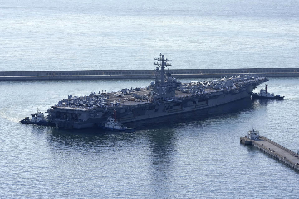 The U.S. carrier USS Ronald Reagan is escorted as it arrives in Busan, South Korea on Sept. 23, 2022. North Korea warned Saturday, Oct. 8, the U.S. redeployment of an aircraft carrier near the Korean Peninsula is causing a “considerably huge negative splash” in regional security, as it defended its recent missile tests as a “righteous reaction” to intimidating military drills between its rivals.(AP Photo/Lee Jin-man)