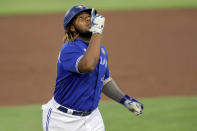 Toronto Blue Jays' Vladimir Guerrero Jr. celebrates as he rounds third base after hitting a solo home run against the Philadelphia Phillies during the first inning of a baseball game Saturday, May 15, 2021, in Dunedin, Fla. (AP Photo/Mike Carlson)