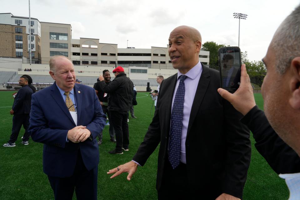 US Senator City Booker talks to people before the event. After years of neglect and abandonment Hinchliffe Stadium is being unveiled at a ribbon cutting in Paterson, NJ on Friday May 19, 2023. 