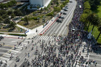 In this photo taken by a drone, thousands of demonstrators protest outside the Federal Building against Israel and in support of Palestinians, Saturday, May 15, 2021 in the Westwood section of Los Angeles. (AP Photo/Ringo H.W. Chiu)