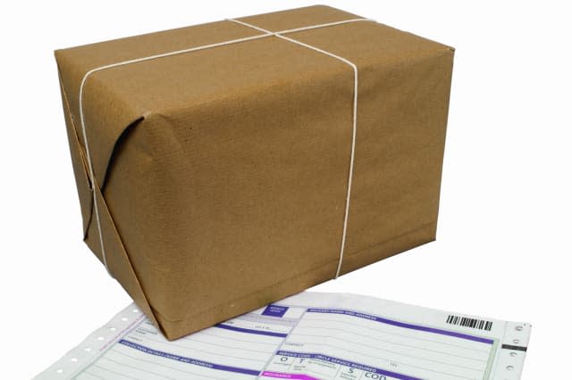 Close up of a delivery document and a parcel