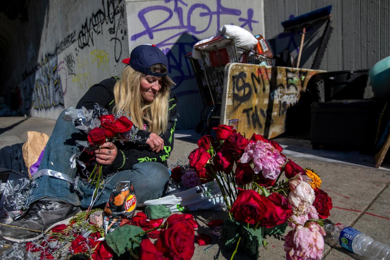 <span>Rue Ryan, 32, puts together a memorial for her old friend in December 2022.</span><span>Photograph: Francine Orr/Los Angeles Times/Getty Images</span>