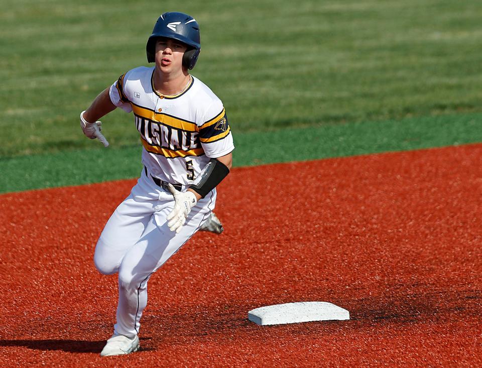 Hillsdale High School's Jack Fickes (5) rounds second base  against Rittman High School during high school baseball action Wednesday, April 19, 2023 at Hillsdale High School. TOM E. PUSKAR/ASHLAND TIMES-GAZETTE