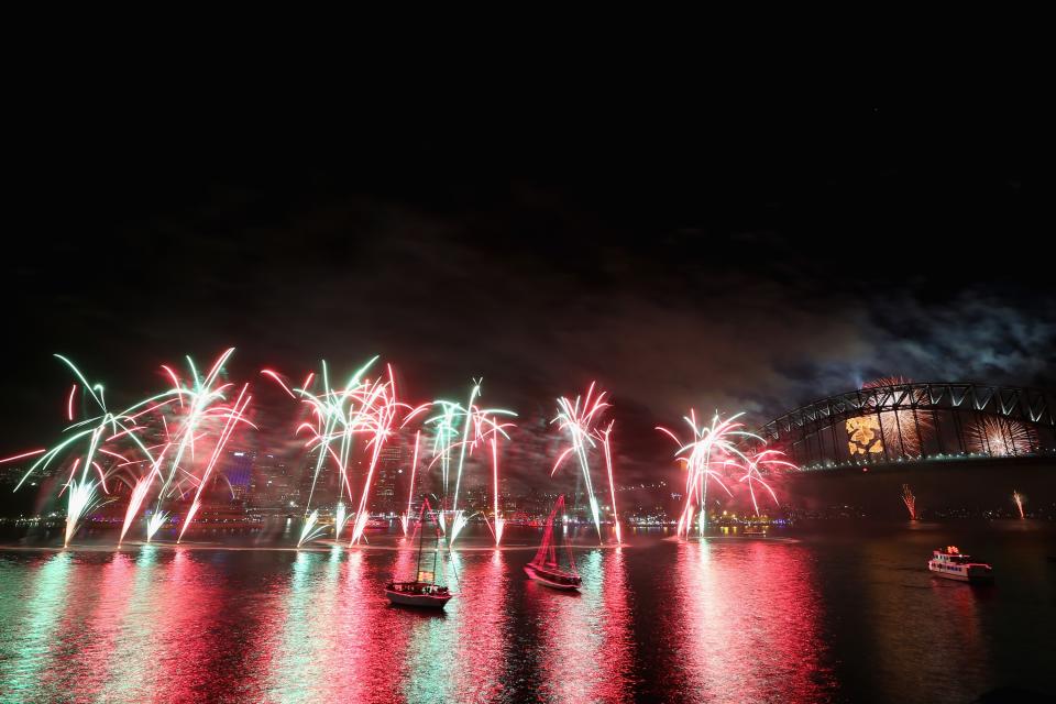 Fireworks light up the sky above the Sydney Harbour Bridge at midnight during New Years Eve celebrations on Sydney Harbour on December 31, 2012 in Sydney, Australia. (Cameron Spencer/Getty Images)