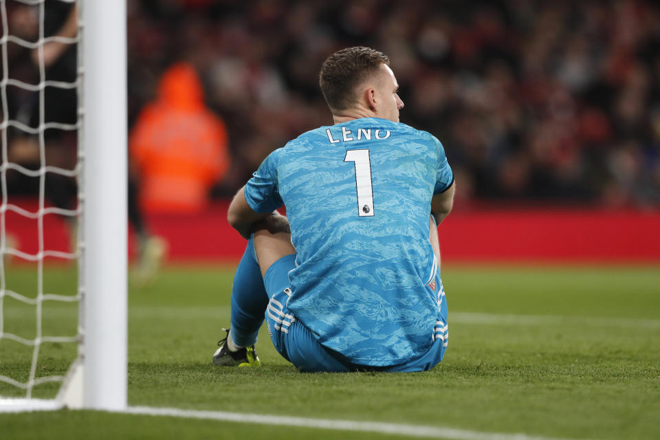 Arsenal's goalkeeper Bernd Leno sits on the pitch after failing to make a stop during the English Premier League soccer match between Arsenal and Brighton, at the Emirates Stadium in London, Thursday, Dec. 5, 2019. (AP Photo/Frank Augstein)