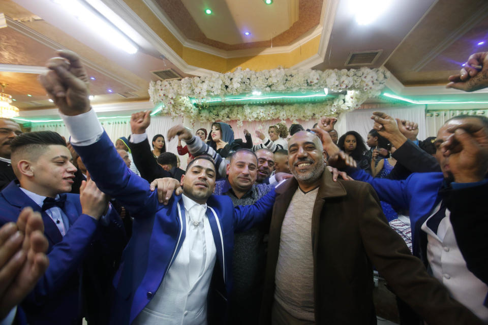 In this Dec. 31, 2016 photo, Arab families of African descent attend a wedding in the West Bank city of Ramallah. In the shadow of the Al-Aqsa Mosque in Jerusalem’s Old City lies the “African Quarter” -- home to a little-known community of nearly 50 Arab families of African descent, who call themselves, "Afro-Palestinians." Descended from Muslim pilgrims from a variety of African countries, they now consider themselves proud Palestinians, despite widespread poverty and occasional discrimination from both Palestinians and Israelis. Several have even participated in violent attacks against Israel. (AP Photo/Nasser Shiyoukhi).