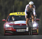 New overall leader, best young rider and best climber, Slovenia's Tadej Pogacar climbs during stage 20 of the Tour de France cycling race, an individual time trial over 36.2 kilometers (22.5 miles), from Lure to La Planche des Belles Filles, France, Saturday, Sept. 19, 2020. (Marco Bertorello/Pool via AP)