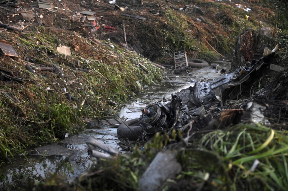 Debris of an Antonov cargo plane is seen in Palaiochori village in northern Greece, Sunday, July 17, 2022, after it reportedly crashed Saturday near the city of Kavala. The An-12, a Soviet-built turboprop aircraft operated by the Ukrainian cargo carrier Meridian, crashed late Saturday as Greek Civil Aviation authorities said the flight was heading from Serbia to Jordan. (AP Photo/Giannis Papanikos)