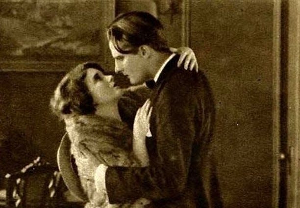 Billy (Gaston Glass) learns that Joy (Viola Dana) isn't so bookwormish after all in the 1922 silent film "Glass Houses."