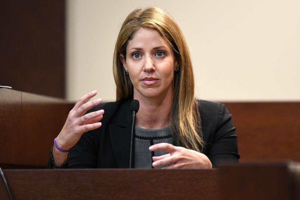 Wendi Adelson, the ex-wife Florida State law professor Dan Markel who was shot and killed in 2014, gestures as she responds to a question asked about her having a type of bourbon in the back of her car on the day Markel was killed. 