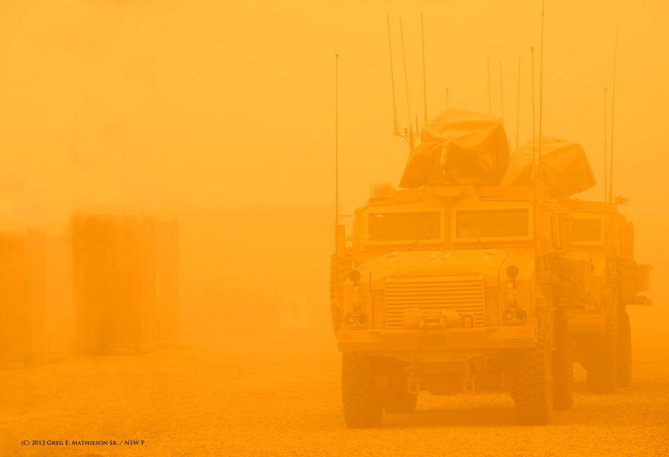 US Navy SEALs driving in heavily armored MRAP vehicles in a dust storm in Iraq.   Photo (C) 2010 Greg E. Mathieson Sr. / NSW Publications, LLC