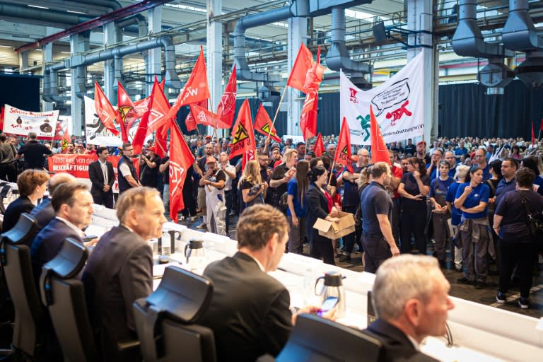 Employees of German carmaker Volkswagen (VW) protest at the start of the company's annual general meeting in Wolfsburg, northern Germany, on September 4, 2024 (Moritz Frankenberg)