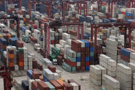 Shipping containers are seen at a port of Kwai Tsing Container Terminals in Hong Kong, Friday, May 24, 2019. Kwai Tsing Container Terminals is one of the busiest ports in the world. (AP Photo/Kin Cheung)