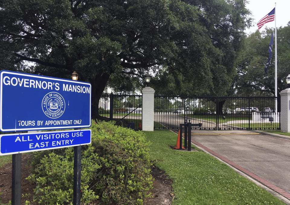 An American flag flies at the entrance to Louisiana Governor’s Mansion on Tuesday, April 23, 2019, in Baton Rouge, La. State police have acknowledged a security breach occurred at the mansion says earlier when a man gained access to the building. (AP Photo/Kevin McGill)