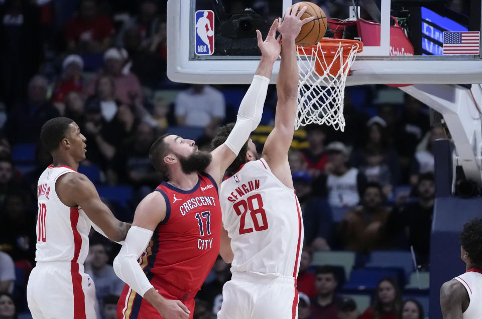 Houston Rockets center Alperen Sengun (28) blocks a shot by New Orleans Pelicans center Jonas Valanciunas (17) in the first half of an NBA basketball game in New Orleans, Saturday, Dec. 23, 2023. (AP Photo/Gerald Herbert)