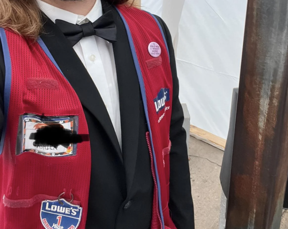 a Lowe's employee wearing a tuxedo