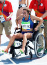 <p>Abbey D’Agostino of the United States is assisted off the track after the Women’s 5000m Round 1 – Heat 2 on Day 11 of the Rio 2016 Olympic Games at the Olympic Stadium on August 16, 2016 in Rio de Janeiro, Brazil. (Photo by Paul Gilham/Getty Images) </p>