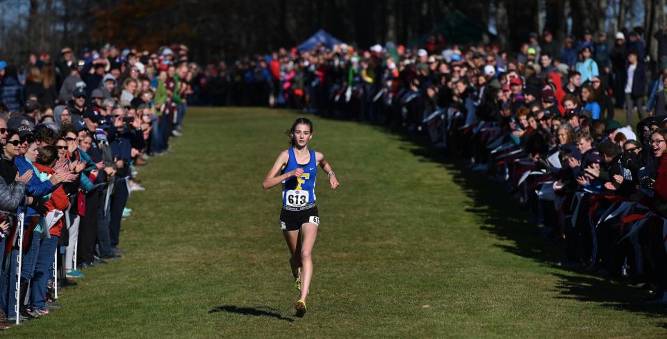 Falmouth's Sofie Matson leads the pack as she heads to the finish line of the Class A high school cross country championships at Twin Brook Saturday, Nov. 2, 2019.