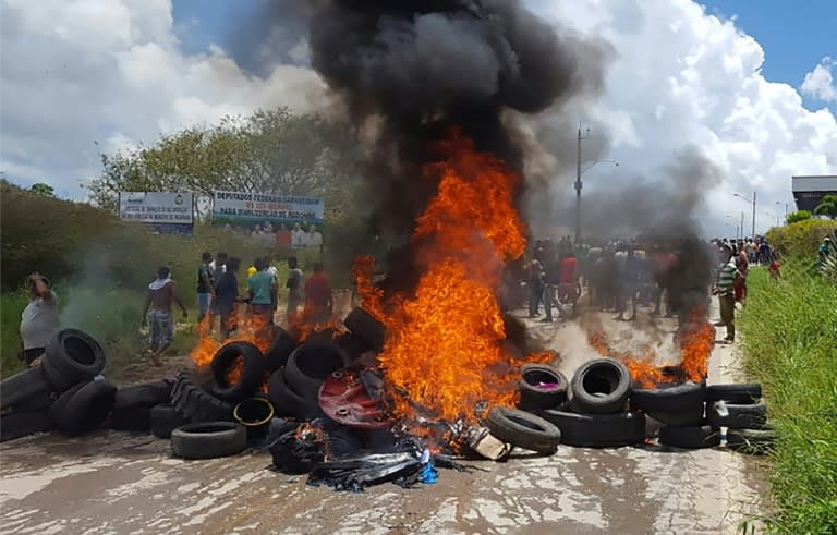 Venezuelans fleeing their country have faced serious difficulties this year -- here, residents of the Brazilian border town of Pacaraima burn tires and belongings of Venezuelan migrants after attacking their two main makeshift camps in August 2018