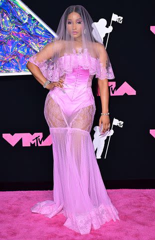 <p>Anthony Harvey/Shutterstock</p> Nicki Minaj channel a Barbie bride at the 2023 MTV VMAs on Sept. 12