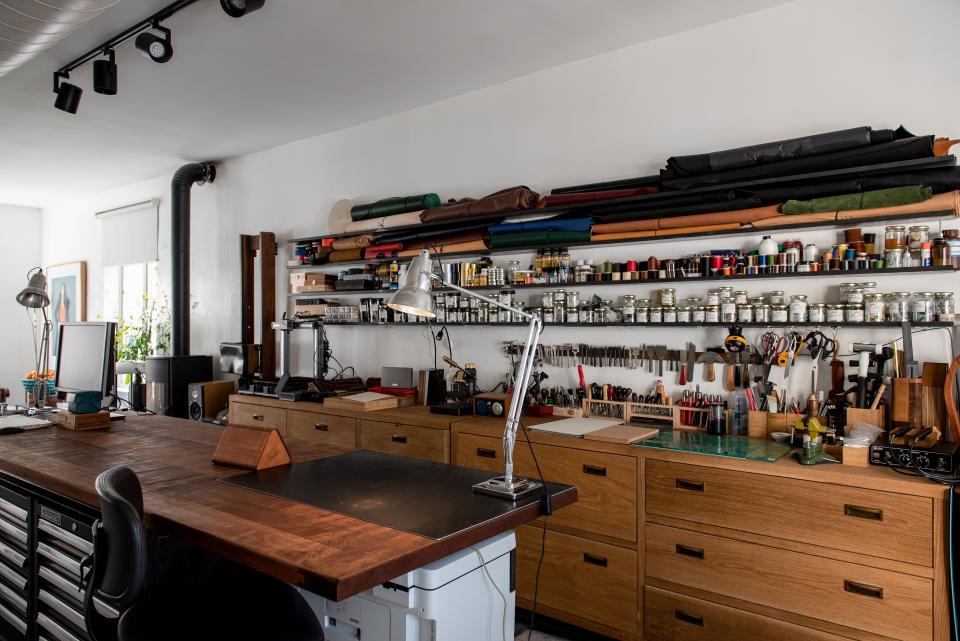 The study has recently been turned into Pollak’s leather studio, where he makes leather portfolio cases, folders, and bags. The work table is crafted from mahogany and includes drawers that contain all of his Signet working tools.