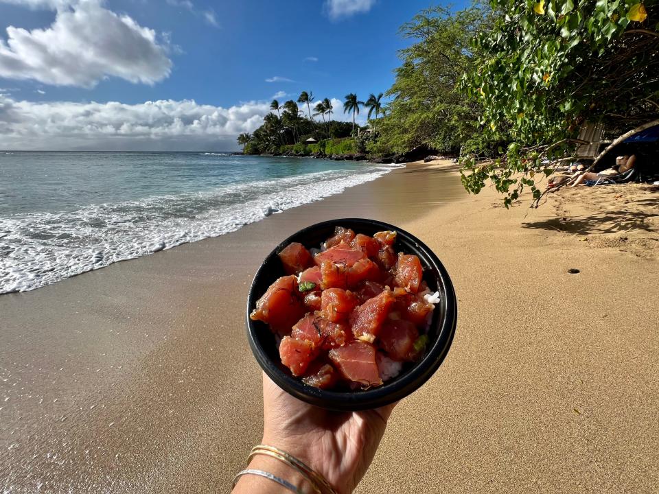 poke bowl in front of the beach in hawaii