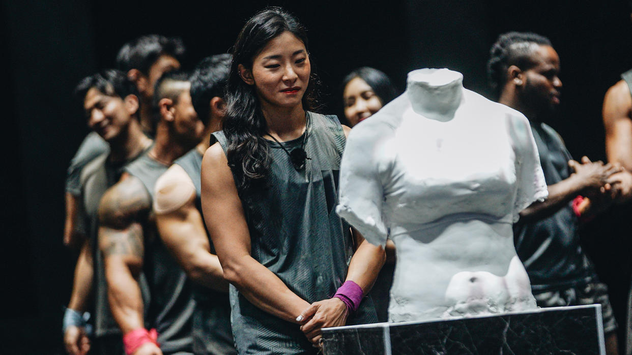  Members of the Physical: 100 season 1 cast stood next to their physique sculptures. 