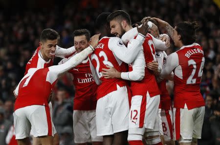 Britain Soccer Football - Arsenal v Leicester City - Premier League - Emirates Stadium - 26/4/17 Arsenal's players celebrate after Leicester City's Robert Huth scores an own goal and the first goal for Arsenal Reuters / Stefan Wermuth Livepic