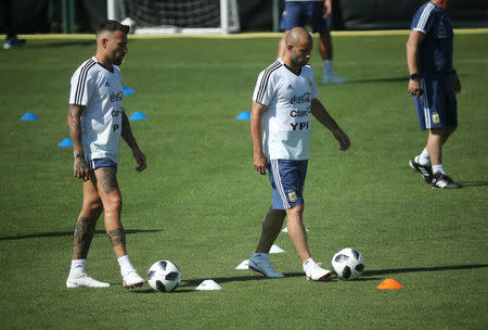 Soccer Football - FIFA World Cup - Argentina Training - Ciutat Esportiva Joan Gamper, Barcelona, Spain - June 8, 2018 Argentina's Javier Mascherano and Nicolas Otamendi during training REUTERS/Albert Gea