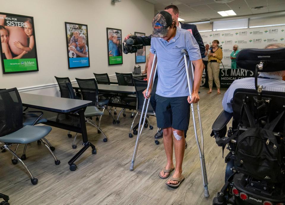 Shark bite survivor Marlin Wakeman, of Stuart, leaves a press conference at St. Mary's Medical Center on May 9, 2024. He was bitten by Carribbean reef sharks after he slipped and fell into the water in the Bahamas.
