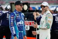 May 23, 2019; Concord, NC, USA; Monster Energy NASCAR Cup Series driver Clint Bowyer (14) talks with driver Jimmie Johnson (48) during qualifying for the Coca-Cola 600 at Charlotte Motor Speedway. Mandatory Credit: Jim Dedmon-USA TODAY Sports