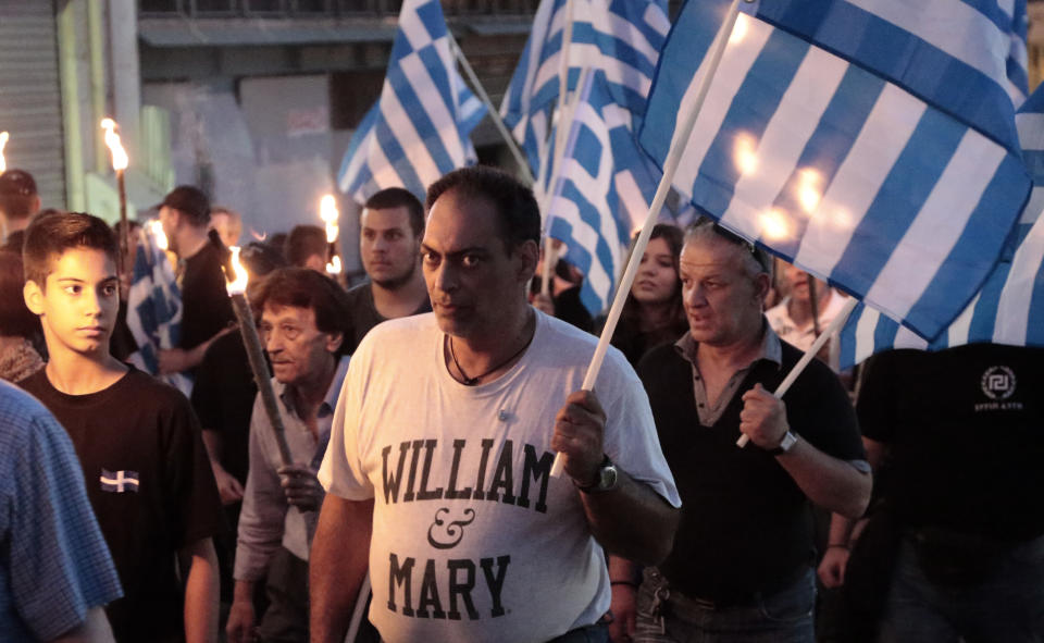 Members and supporters of the extreme right party Golden Dawn march in central Athens on Wednesday May 29, 2013, during a rally marking the anniversary of the fall of Constantinople to the Ottoman Empire in 1453. (AP Photo/Dimitri Messinis)