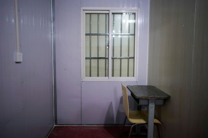 Desk and chair are seen inside a convention center that was used as a makeshift hospital in Wuhan