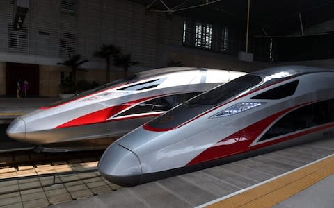 Two Fuxing trains are seen at the Tianjin Railway Station in Tianjin, north China, Aug. 21, 2017 - Credit:  Xinhua / Barcroft Images